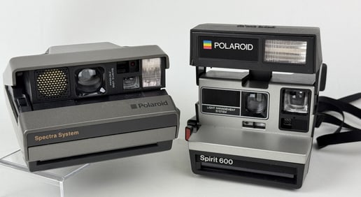 Pair of Vintage Polaroid Cameras 600 & Spectra Untested. Some scuffs and scratches.
