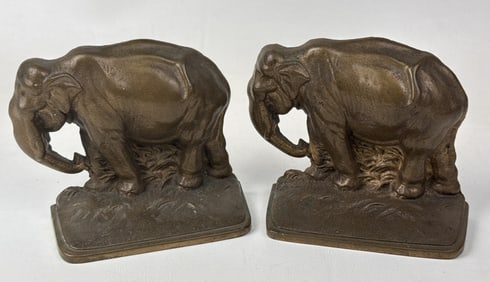 Vintage Cast Bronze Elephant Bookends No makers mark. Each bookend measures 4.5 inches x 4.5 inches