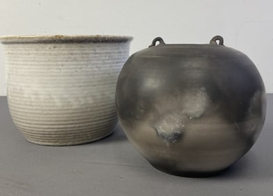 Zanesville & Saggar Fired Pots Zanesville ringed pot, unglazed on the bottom and marked 1005. Chip
