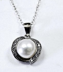 Sterling Silver Pearl & CZ Swirl Necklace Necklace weighs 2.9 Grams Measures 22"