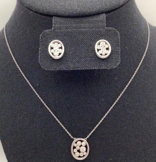 950 Sterling Cubic Zirconia Cluster Necklace & Earrings: Earrings Necklace is 16" & 5.3 TGW Earrings are 5.2 TGW Necklace is marked 950. Earrings acid tested Sterling.