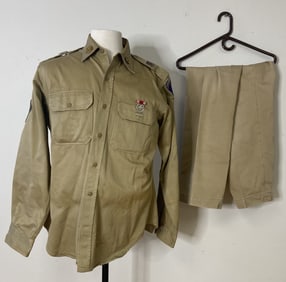 Military Shirt and Pant Set Khaki Army shirt and pants. Shirt has some sewn patches and pins. It is
