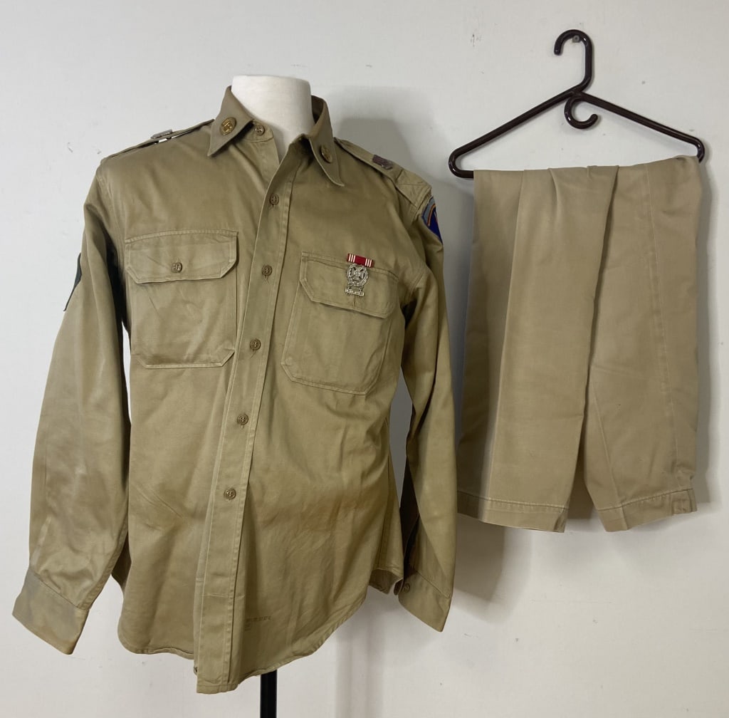 Military Shirt and Pant Set Khaki Army shirt and pants. Shirt has some sewn patches and pins. It is: Khaki Army shirt and pants. Shirt has some sewn patches and pins. It is marked 16 1/2 X 35. Pants are unmarked. Pants measurements lying flat are Waist: 16 1/2 inches Hips: 19 inches Length from Waist