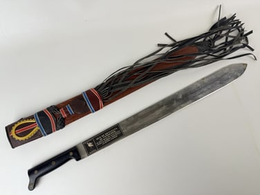 Vintage Garza Machete and Sheath Some tarnish and rust on blade. 25 inches long