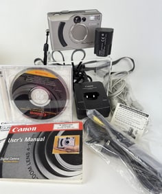 Canon Powershot A5 Zoom Powers on. Otherwise untested. Includes charger, battery, cables and cd. 10