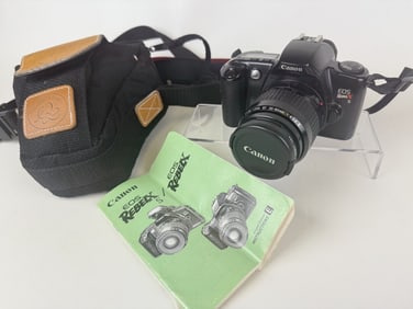 Canon Rebel XS 35mm Camera Good cosmetic condition. Untested. Includes manual and case. 7 x 7 x 8