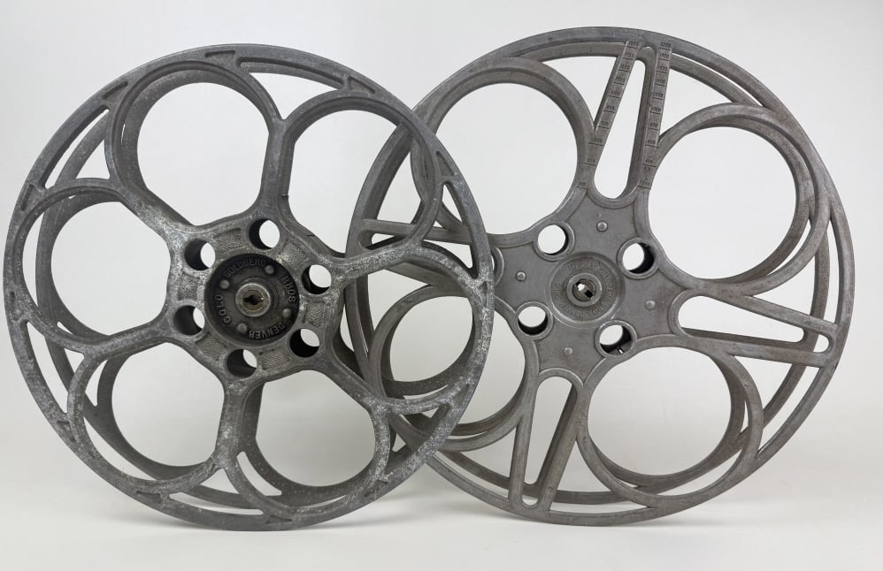 Goldberg Bros 35mm Film Aluminum House Reels 15 inches wide by 2 inches tall. From closed movie: 15 inches wide by 2 inches tall. From closed movie theater collection. Signs of age/wear. One has crack. See photos