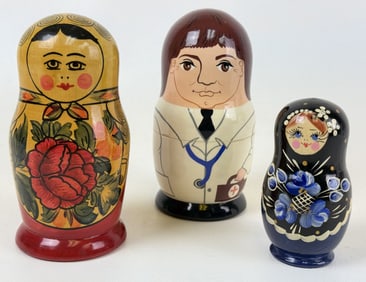Russian Wooden Nesting Dolls Lot of 3 Two 5 inches tall by 2.5 inches wide. One is 3.5 inches tall