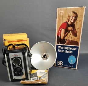 Kodak Duaflex II TLR Camera & Box Flash & Bulbs Camera measures 3 x 3 x 5 inches. Strap is sticky.