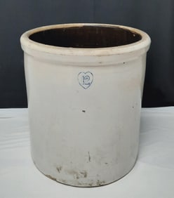 Vintage 12 Gallon Stoneware Crock Measures 16x16x18 inches tall. Dirty, cracks present and chips.