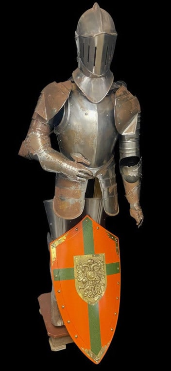 Suit of Armor with Shield Suit of armor on wooden frame, missing pelvis piece. Comes with orange