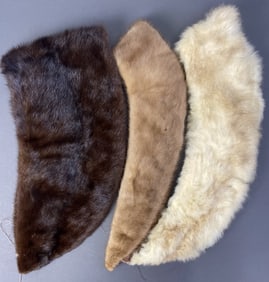 Three Vintage Mink Fur Collars Three collars made of mink fur, white, light brown, and dark brown.