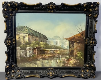 Signed Oil Painting in Ornate Frame Painting of two figures in between two buildings, signed G