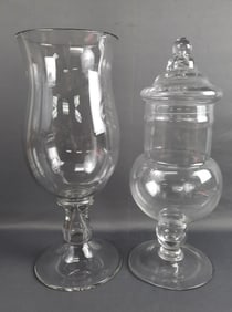 Pair of Tall Clear Glass Jars One with Lid Both measure approximately 17 inches tall. Please see