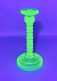Uranium Vaseline Glass Candlestick 8 inches tall. Please see images for details regarding the