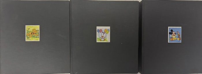 Vintage Disney World of Stamps Binders Partially filled. 7 x 11 x 12 inches.