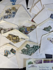 Mixed Mystery Stamp Lot Many envelopes or stamps. Not catalogued or inventoried. 6 x 5 x 3 inches