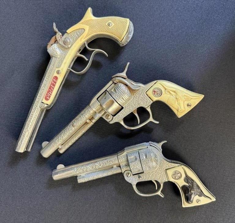 Vintage 50s Cap Gun Lot Texan Pirate Corrosion and rust present overall. Approximately x 3 inches: Corrosion and rust present overall. Approximately x 3 inches each. Some cracks in grips. See photos for condition details.