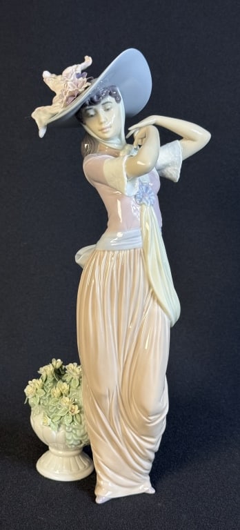 Lladro Porcelain Figurine 6280 Paris In Bloom 12 inches tall 4 inches wide. Good condition free from: 12 inches tall 4 inches wide. Good condition free from cracks or chips.