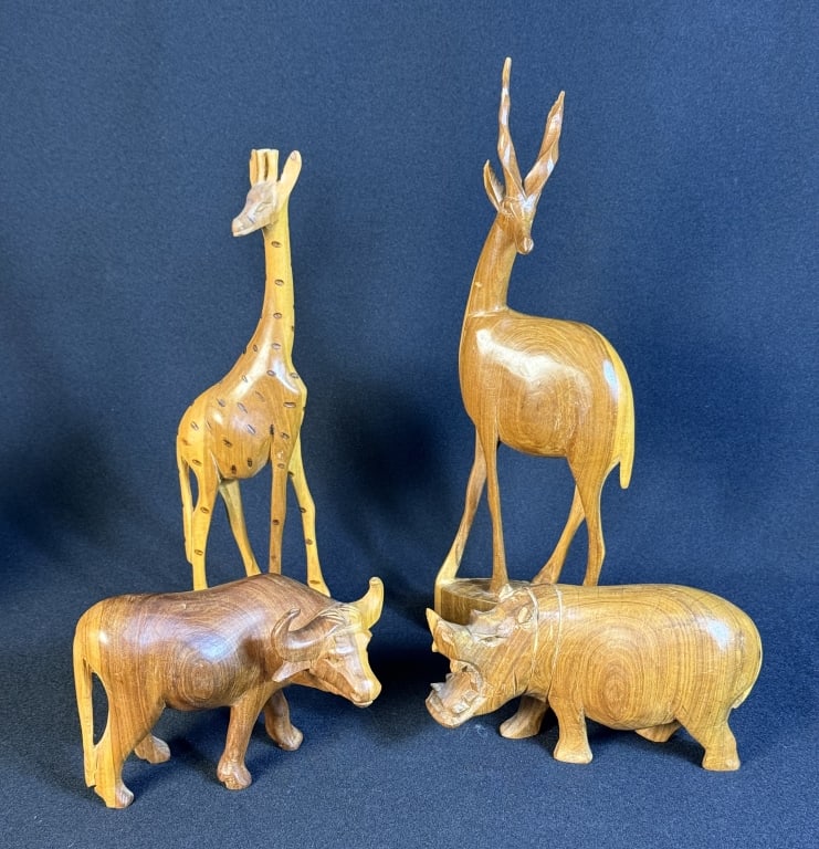 Carved Wooden African Animal Lot Some scuffs and scratches present. Broken antelope horn. 13 x 11 x: Some scuffs and scratches present. Broken antelope horn. 13 x 11 x 7 inches total lot size.