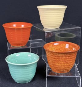 Vintage Bauer Pottery Custard Cups 4 pieces measuring 2.5 inches tall by 3.5 inches wide.