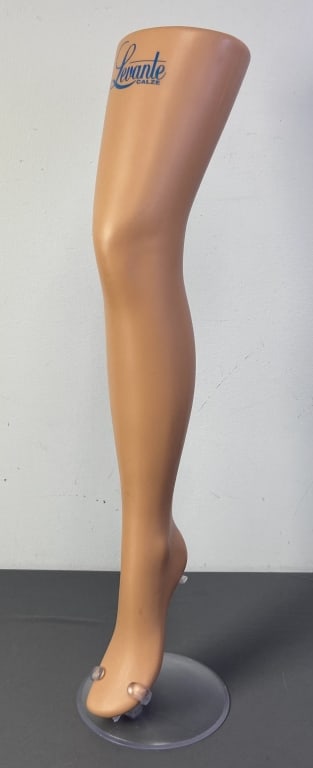 Levante Calze Display Leg with Stand Mannequin display leg marked Levante Calze in blue script at: Mannequin display leg marked Levante Calze in blue script at the top. Comes with clear plastic stand. Leg is 29 inches long.