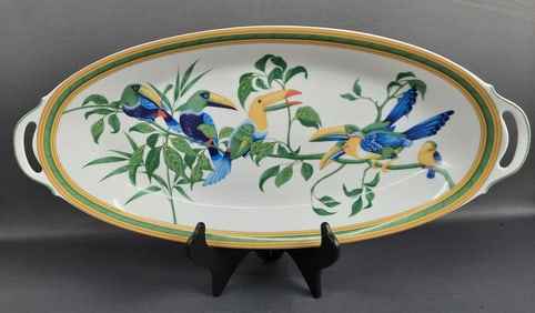 Hermes Toucans Fish Platter with Stand Measures 24 x 11 inches. Scuffs on the bottom rim where it