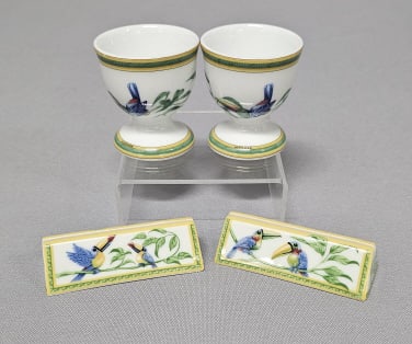 Hermes Toucans Egg Cups & Menu Holders Menu holders measure 3 inches. Egg cups measure 2 inches: Menu holders measure 3 inches. Egg cups measure 2 inches tall. One menu holder has a chip, see pictures.