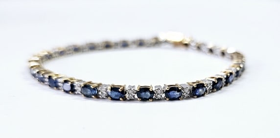 14K Sapphire & Diamond Tennis Bracelet Bracelet weighs 9.7 Grams 1/3 CT TDWT 30 4x3 Oval Sapphires
