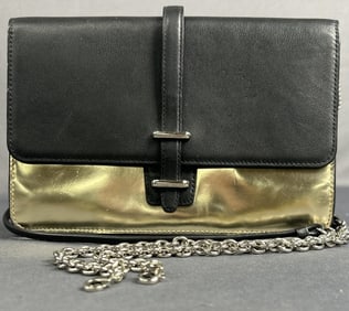 Coach Clutch Metallic Gold & Black Metallic gold and black Coach clutch with removable shoulder