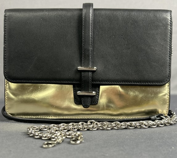 Coach Clutch Metallic Gold & Black Metallic gold and black Coach clutch with removable shoulder: Metallic gold and black Coach clutch with removable shoulder strap. Scuffs on gold exterior. Clean interior. 6 in height, 9.5 in width