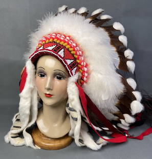 Authentic Native American Cheyenne War Bonnet War bonnet or headdress made with eagle feathers,: War bonnet or headdress made with eagle feathers, horsehair, and beadwork. Includes tag from Comanche Gap in Oklahoma. War bonnet is around 14 inches wide.