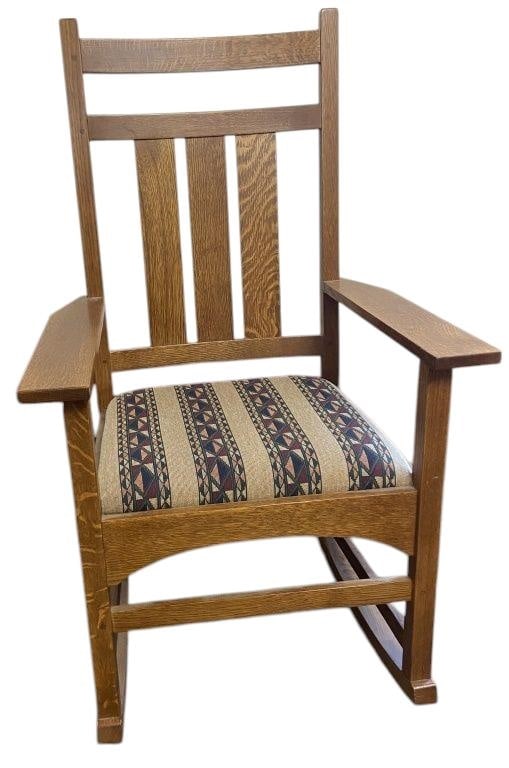 Mission Style Rocking Chair Modern wooden rocking chair in the Mission style with a geometric: Modern wooden rocking chair in the Mission style with a geometric patterned upholstered seat. Chair is 41 1/2 inches tall, 24 3/4 inches long, and 17 1/2 inches deep.