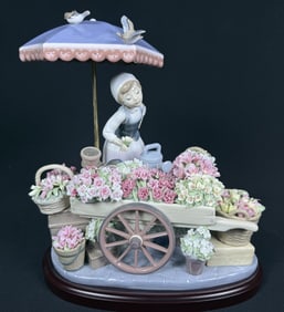 Lladro Figurine 1454 Flowers of The Season With wooden base. 11 inches tall by 11 inches long by 7