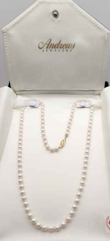 Andrews Jewelers Pearl Necklace With 14K Clasp Canada: Canada Clasp is marked 14K. Necklace is 24" & weighs 25.9 grams. Lot weighs 8.74 ounces.