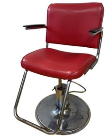 Vintage Red Upholstered Barber Chair Red pleather upholstered hair dresser's or barber's chair.