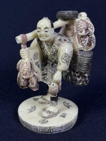 Vintage Japanese Carved Resin Peddler Figurine 3.5 inches tall by 2.5 inches wide.
