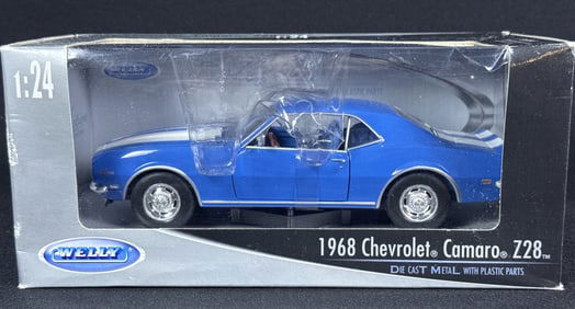 1968 Chevy Camaro Z28 1:24 Diecast Model by Welly In box measuring 9 x 4.5 x 4 inches. Some wear on