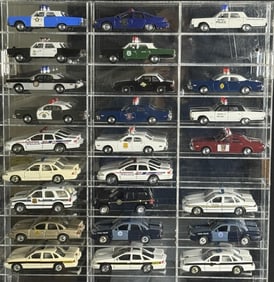Diecast Police Cars Collection 1/43 Scale 25 cars in acrylic mirror backed case. Case has some