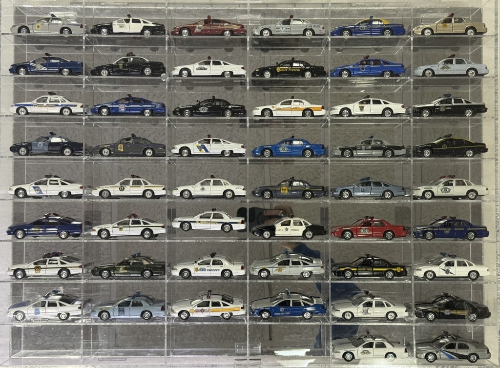 Diecast Police Cars Collection 1/43 Scale 50 cars in acrylic mirror backed case. 32.5 x 24 x 2.5 (1 of 12)