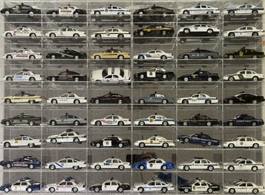 Diecast Police Cars Collection 1/43 Scale 54 cars in acrylic mirror backed case. 32.5 x 24 x 2.5