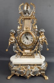 Italian Cherub Marble Gold Tone Mantle Clock Measures 13 x 7 x 22 inches tall. Weighs 26 pounds.