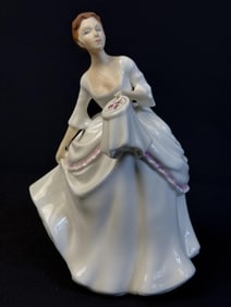 Royal Doulton Figurine HN 2961 Carol 7.5 inches tall 5 inches wide. Free of chips or cracks.