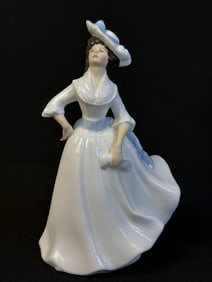 Royal Doulton Figurine HN 2397 Margaret 7.5 inches tall 4 inches wide. Free of chips or cracks.