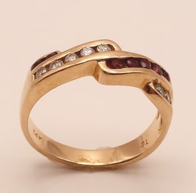 14K Yellow Gold Ruby Cubic Zirconia Ring Size 6 Weighs 3.4 grams.