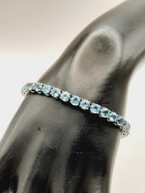 925 Sterling Blue Topaz Tennis Bracelet Weighs 13.7 grams.
