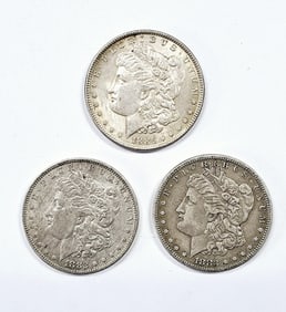 Three 1882 1883 1868 Morgan Silver Dollars See images regarding condition.