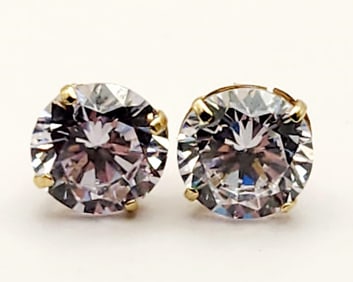 10K Yellow Gold Solitaire Cubic Zirconia Earrings Earrings Weigh 1.7 grams.