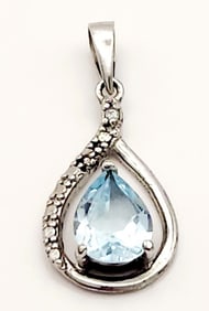 925 Sterling Blue Topaz Teardrop Pendant Weighs 1.3 grams.