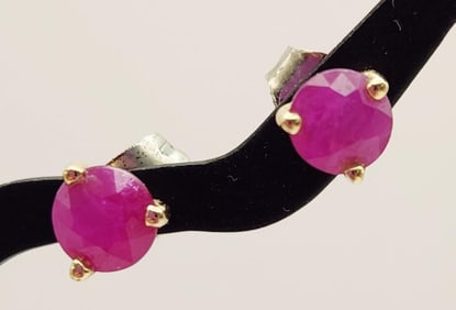 14K Yellow Gold Ruby Stud Earrings Weighs 0.8 grams. Backs are not 14K.